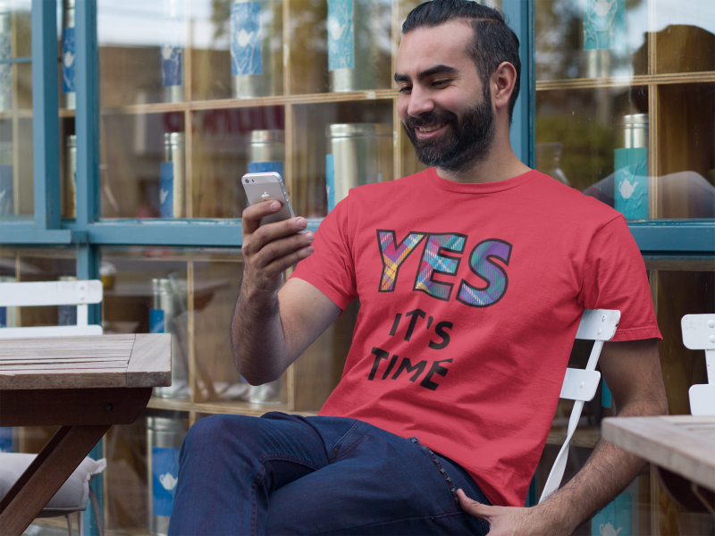 YES-TARTAN-t-shirt-mockup-of-a-man-using-his-iphone-outdoors-a8234