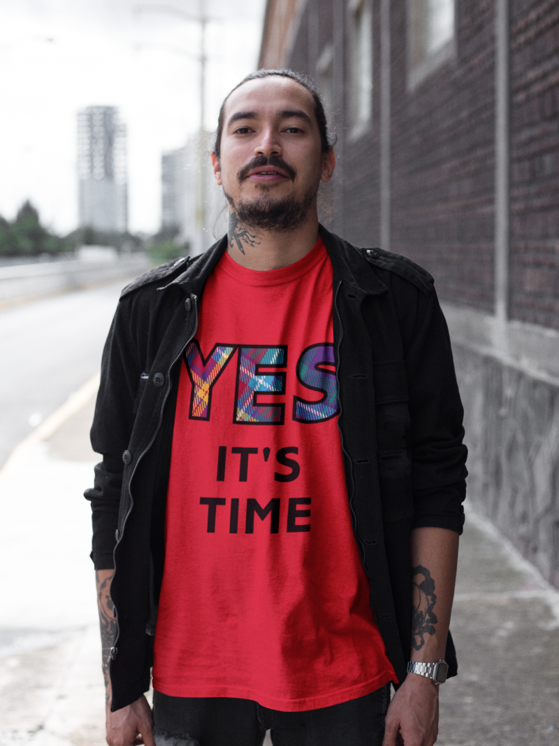 YES-TARTAN-tattooed-man-wearing-a-tshirt-mockup-and-a-black-jacket-while-walking-on-the-street-a17080